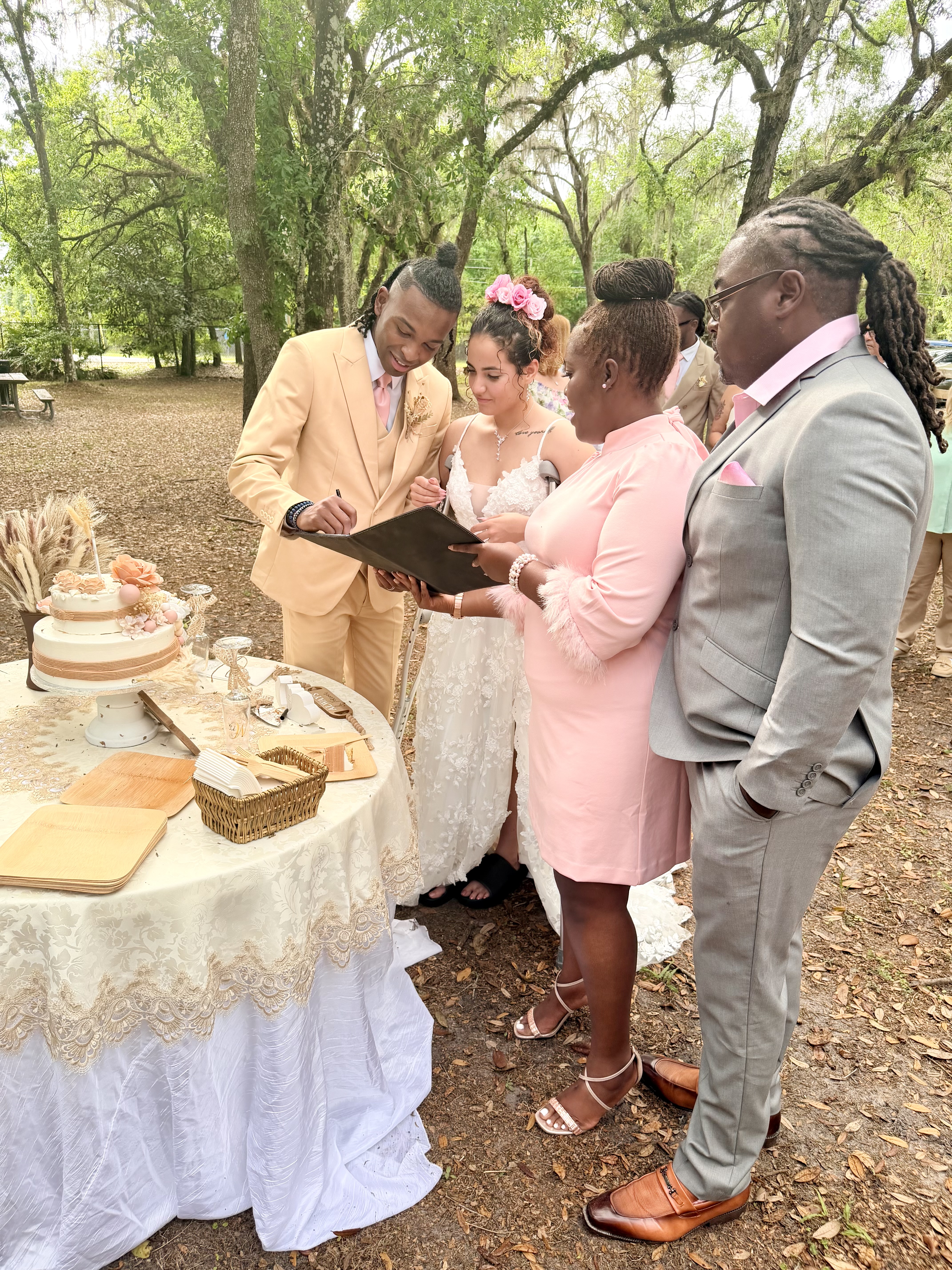 Couple signing the marriage certificate